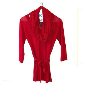 Red top with detailed scarf and belt.